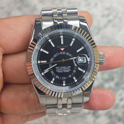 Skyteiko Black Seiko mod Sky-Dweller style watch with black dial and Jubilee bracelet on wrist