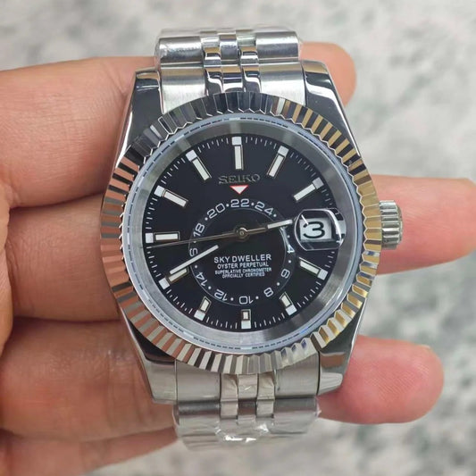 Skyteiko Black Seiko mod Sky-Dweller style watch with black dial and Jubilee bracelet on wrist